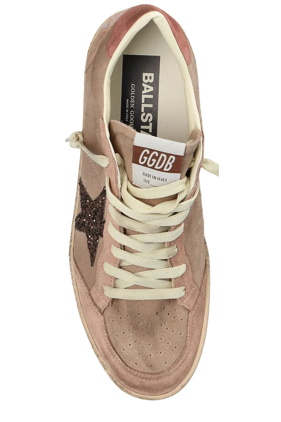 Beige sneaker with a star detail on a white background