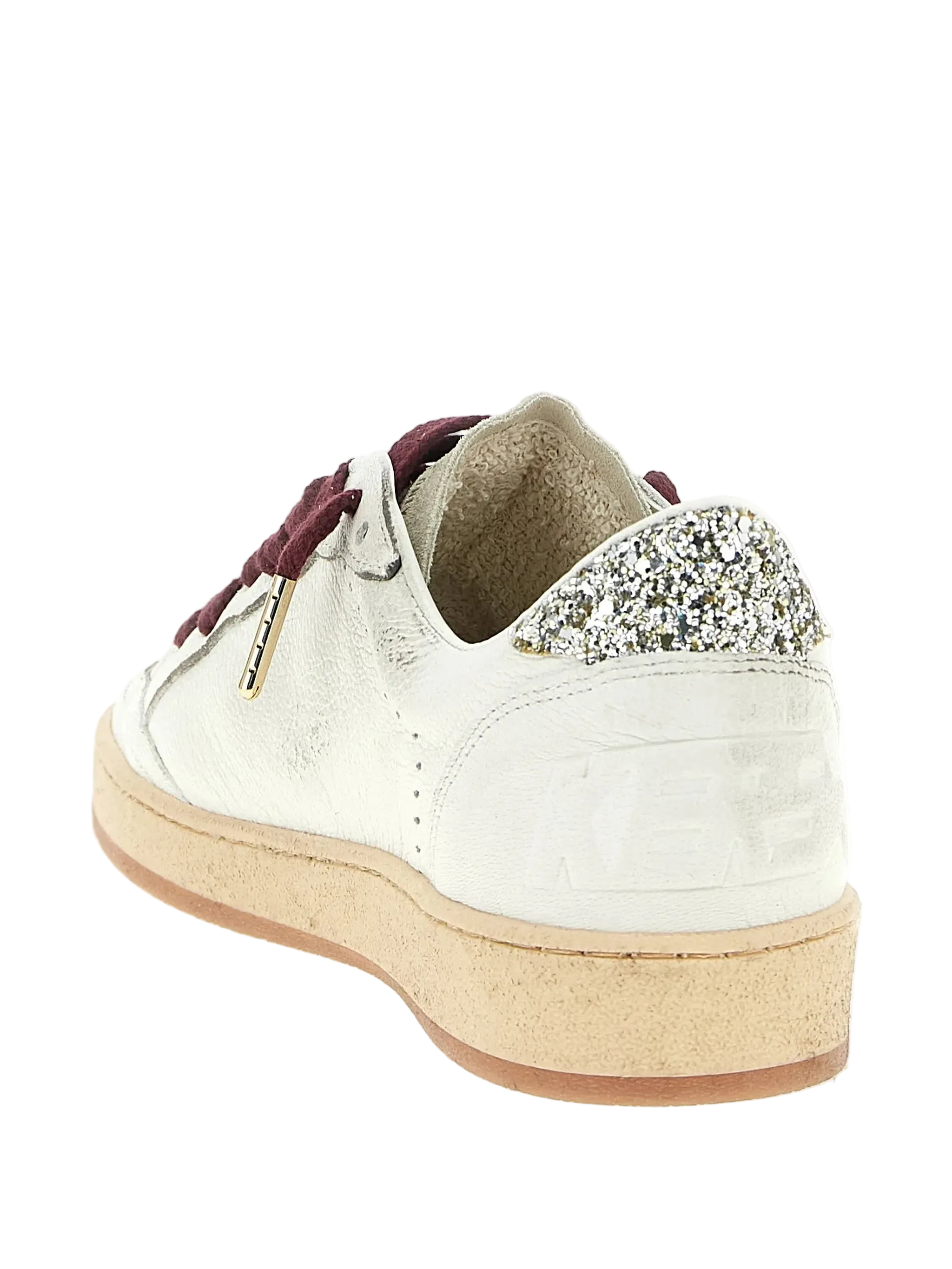 White sneaker with glittery heel and burgundy laces on a white background