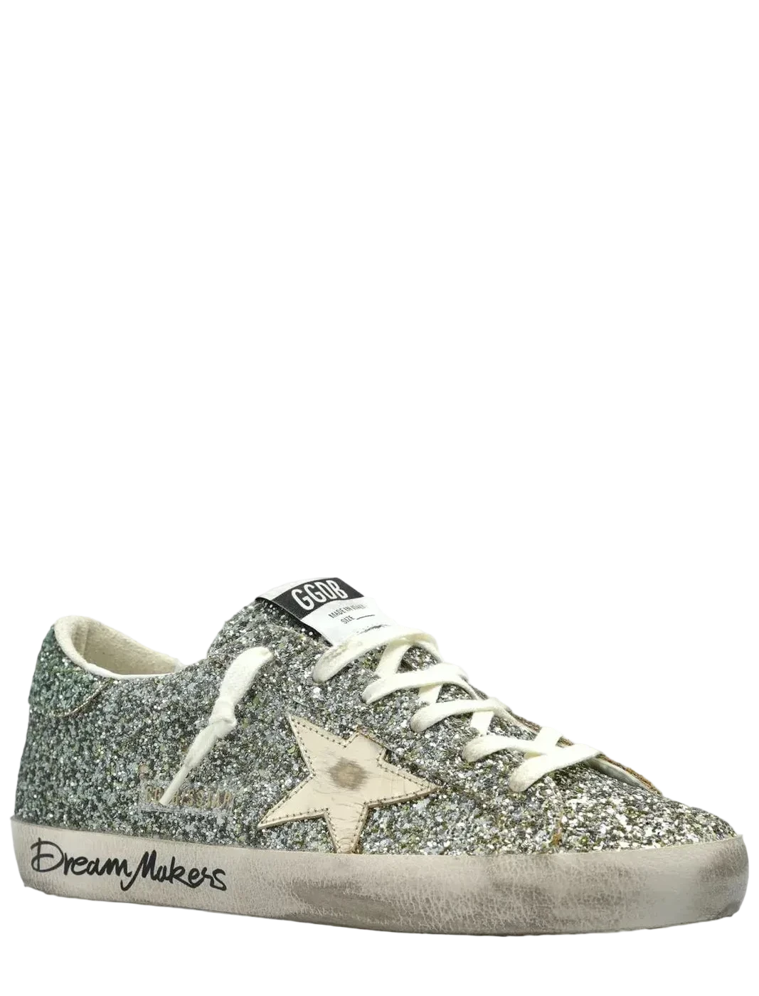 Silver glitter sneaker with a star design on a white background