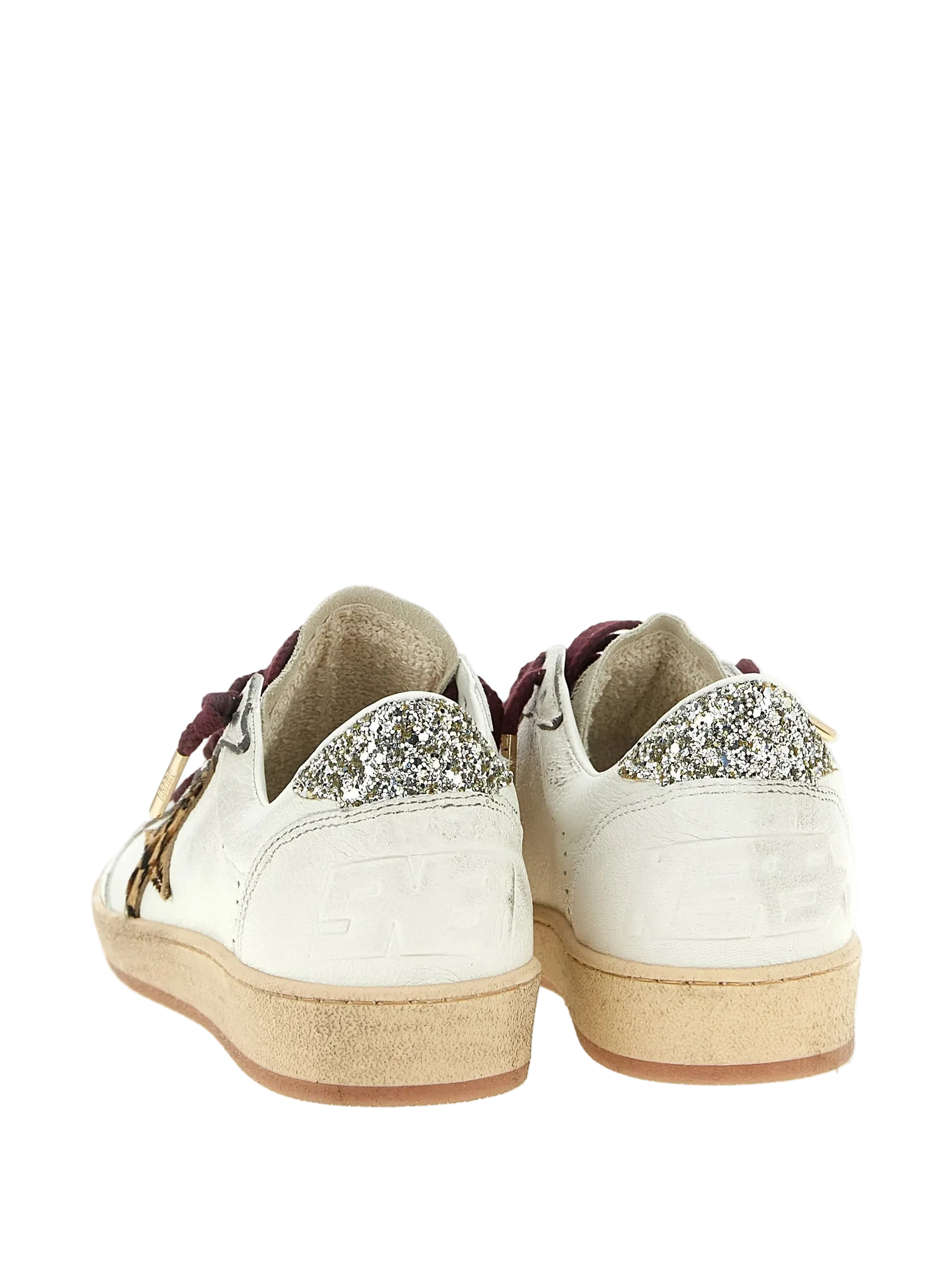 White sneakers with glittery accents on a white background
