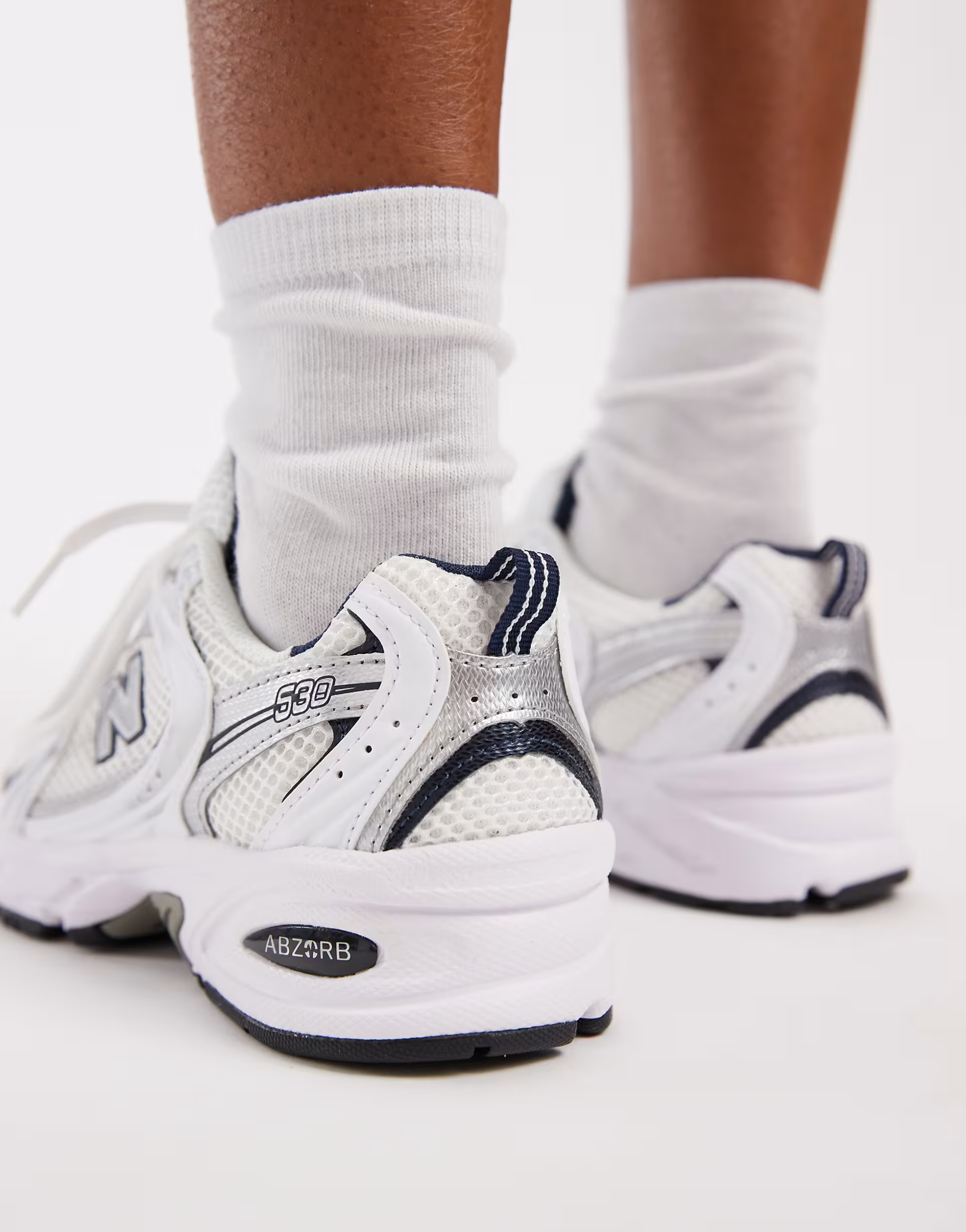 New Balance 530 sneakers in white and gray